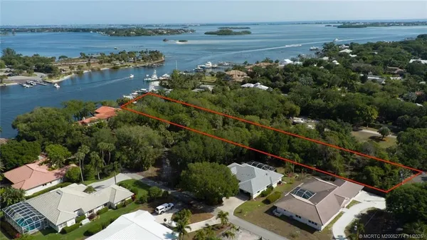 an aerial view of ocean with residential house with outdoor space