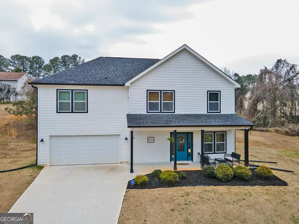 front view of a house with a yard