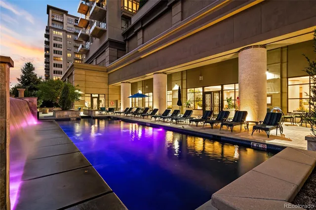a view of swimming pool with outdoor seating