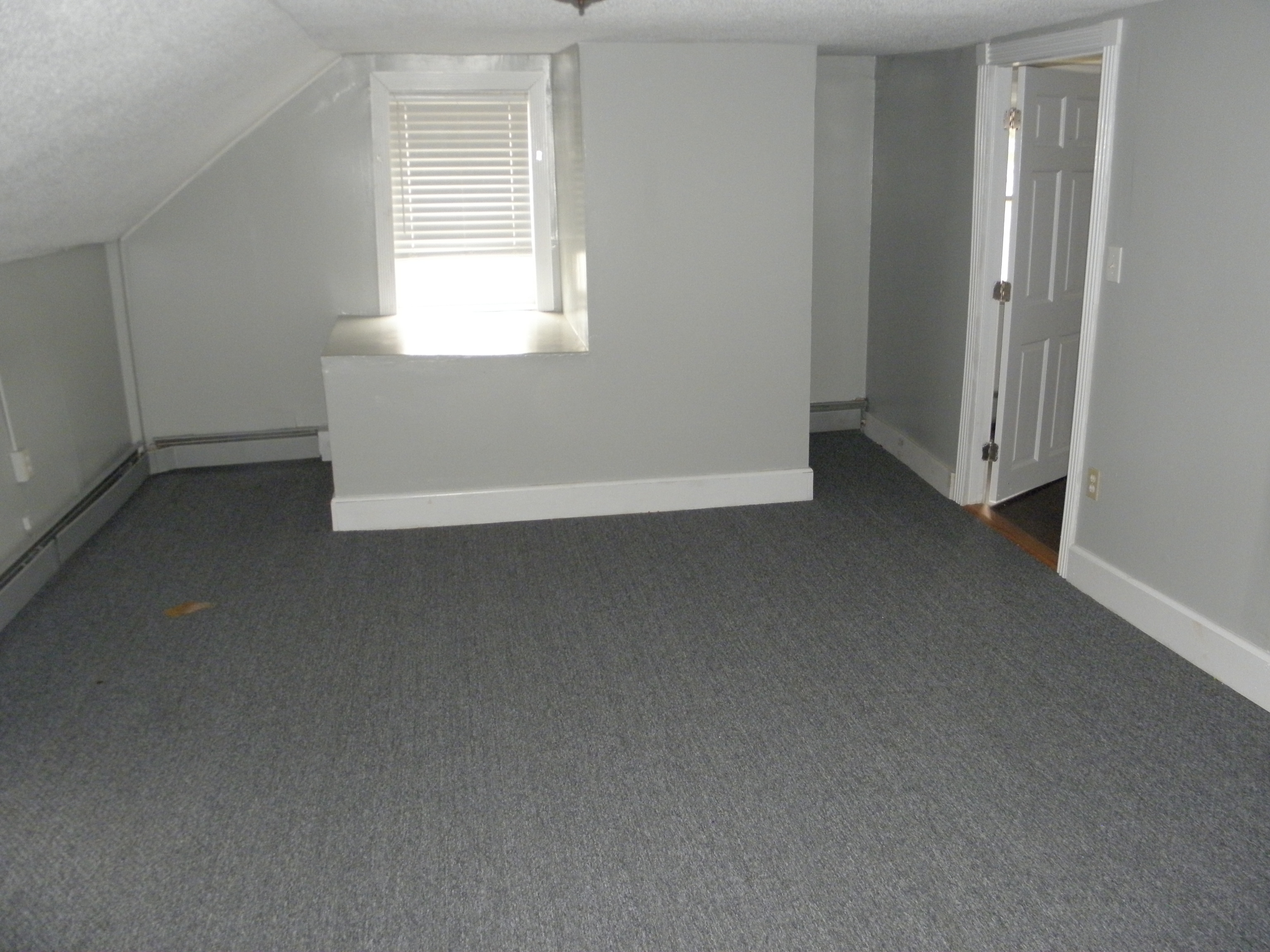 29 Union Street Plainfield, CT 06354 - Photo 2 of 12 an empty room with windows