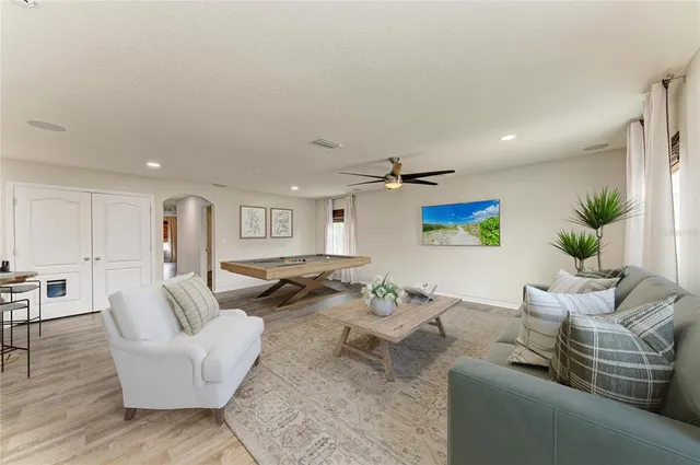 a white toilet sitting next to a shower