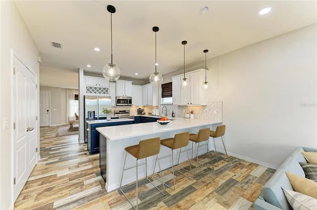 a bathroom with a sink and mirror with toilet