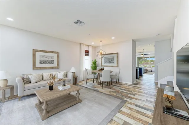 a bathroom with a granite countertop sink mirror and bathtub