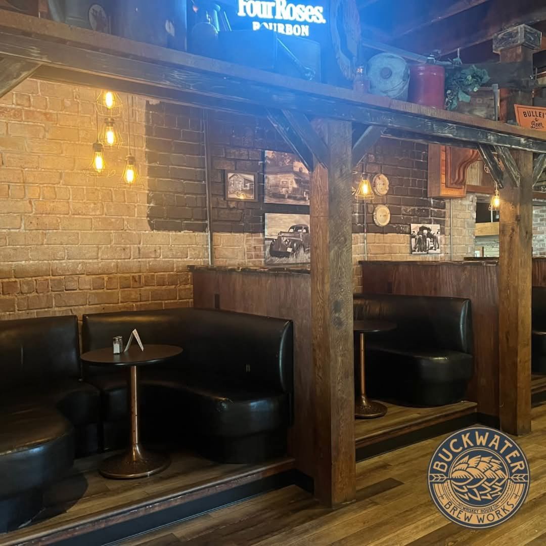 213 East Main Street Carbondale, IL 62901 - Photo 11 of 17 a living room with a fireplace and a table