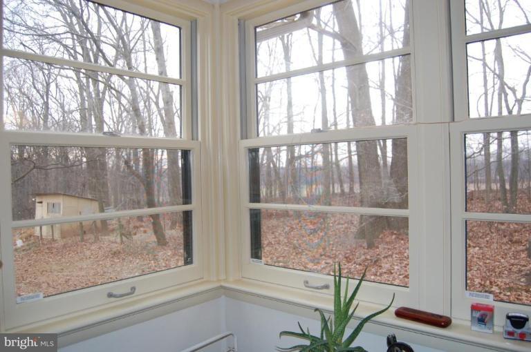 2367 Carrollton Road Westminster, MD 21157 - Photo 11 of 22 a view of a room that has a window and wooden floor