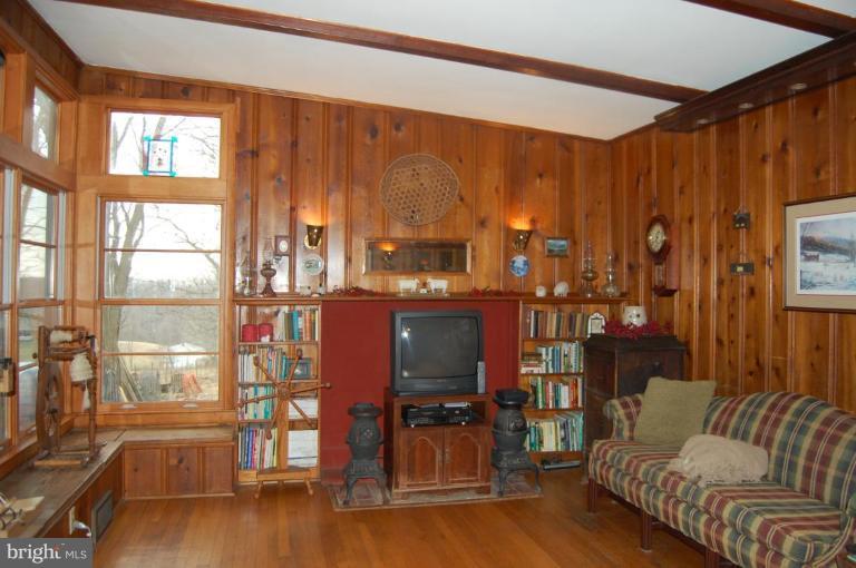 2367 Carrollton Road Westminster, MD 21157 - Photo 6 of 22 a living room with furniture and a fireplace