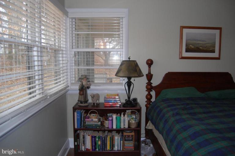 2367 Carrollton Road Westminster, MD 21157 - Photo 10 of 22 a bedroom with a bed and a book shelf