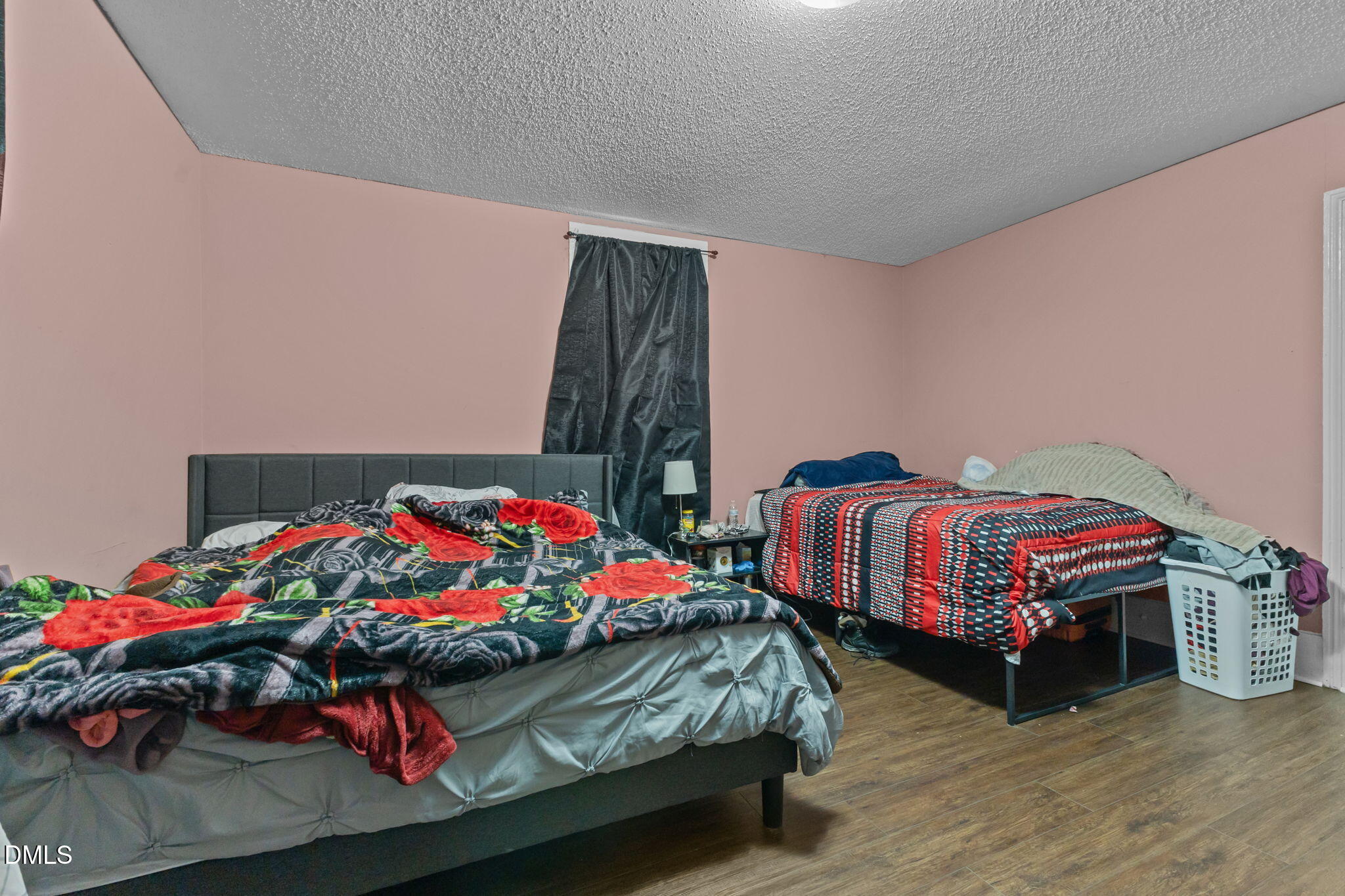 300 Devane Street Clinton, NC 28328 - Photo 13 of 39 a bedroom with two beds and a dresser