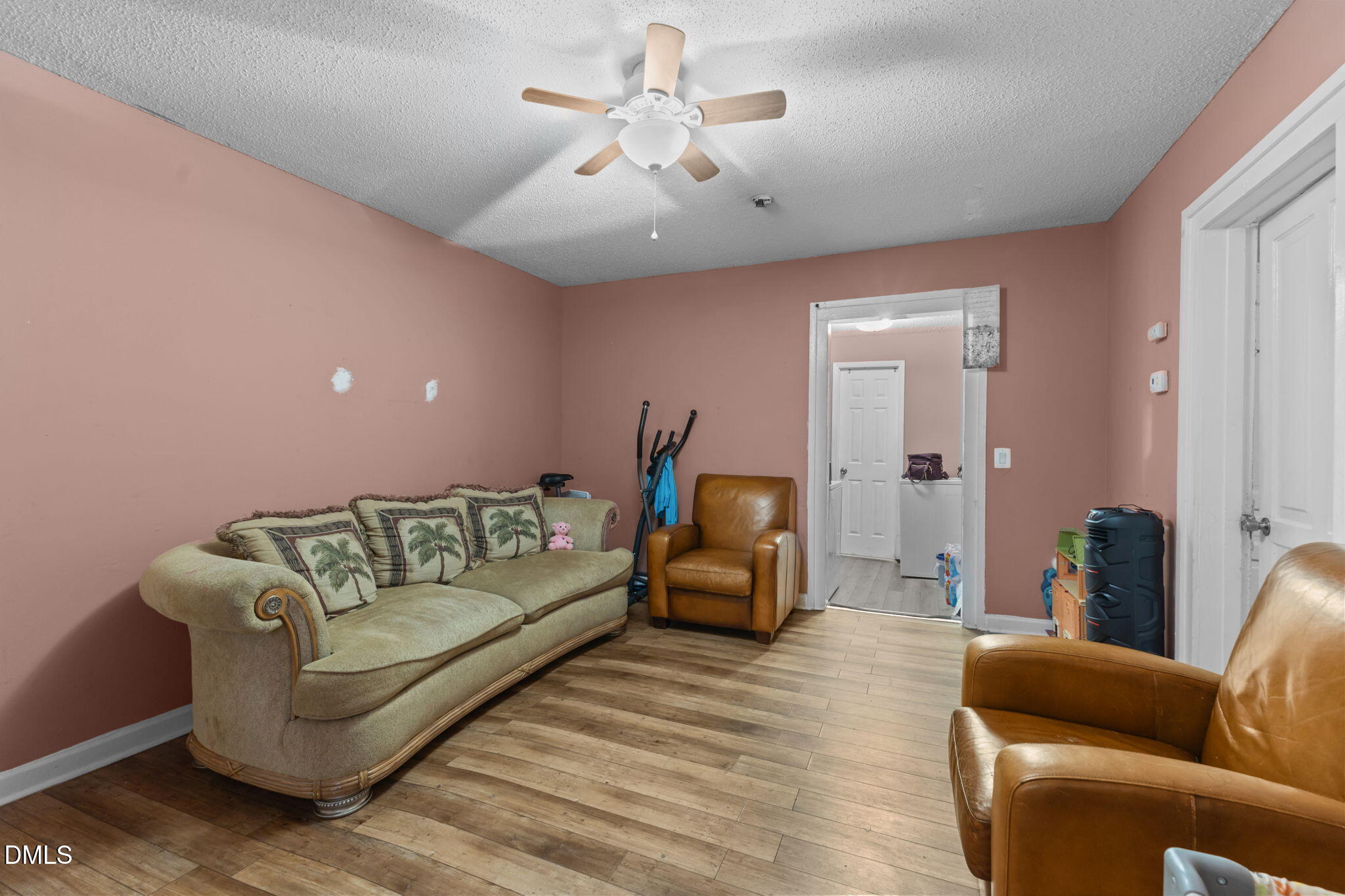 300 Devane Street Clinton, NC 28328 - Photo 18 of 39 a living room with furniture and a chandelier