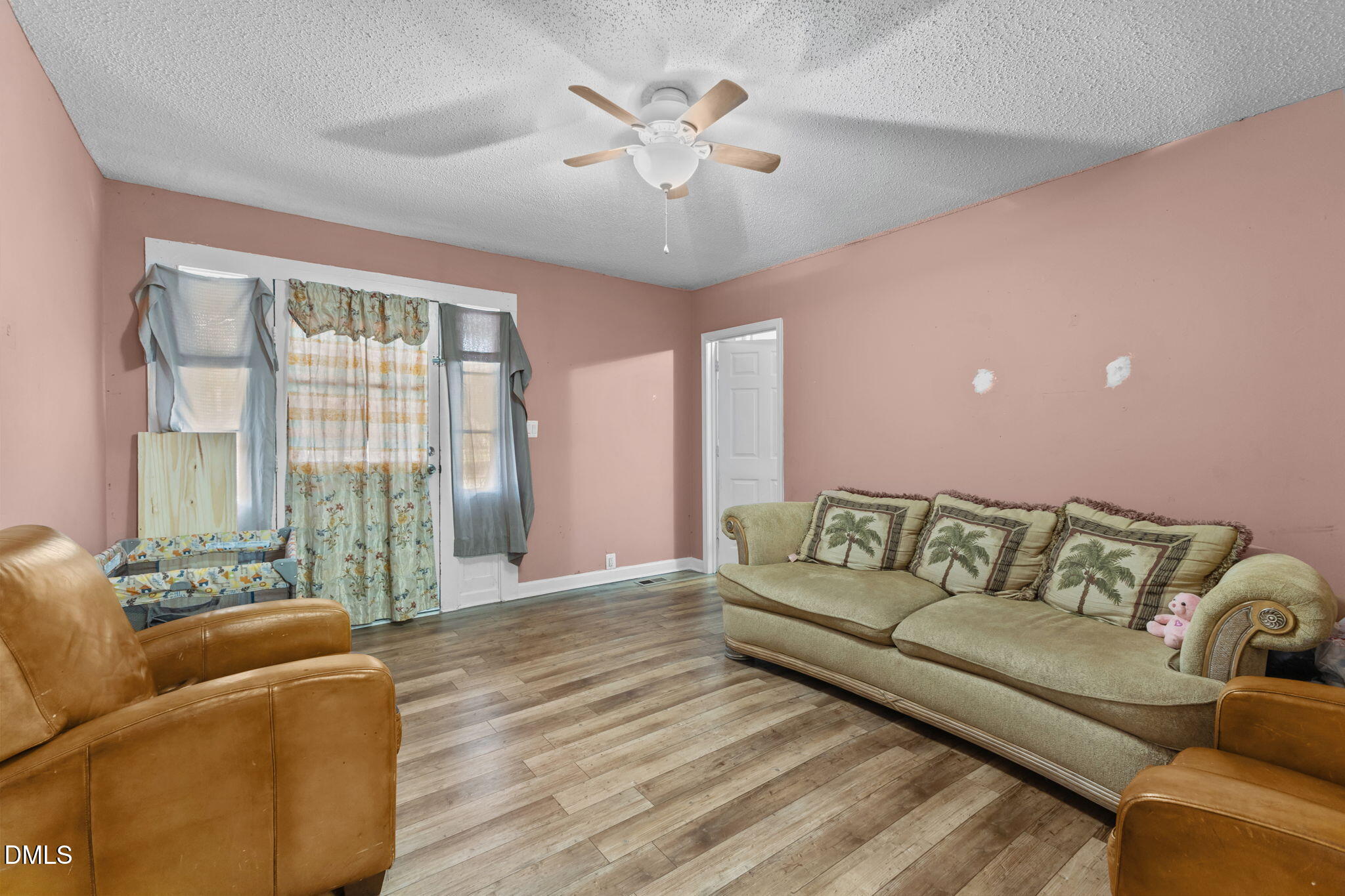 300 Devane Street Clinton, NC 28328 - Photo 19 of 39 a living room with furniture and a large window