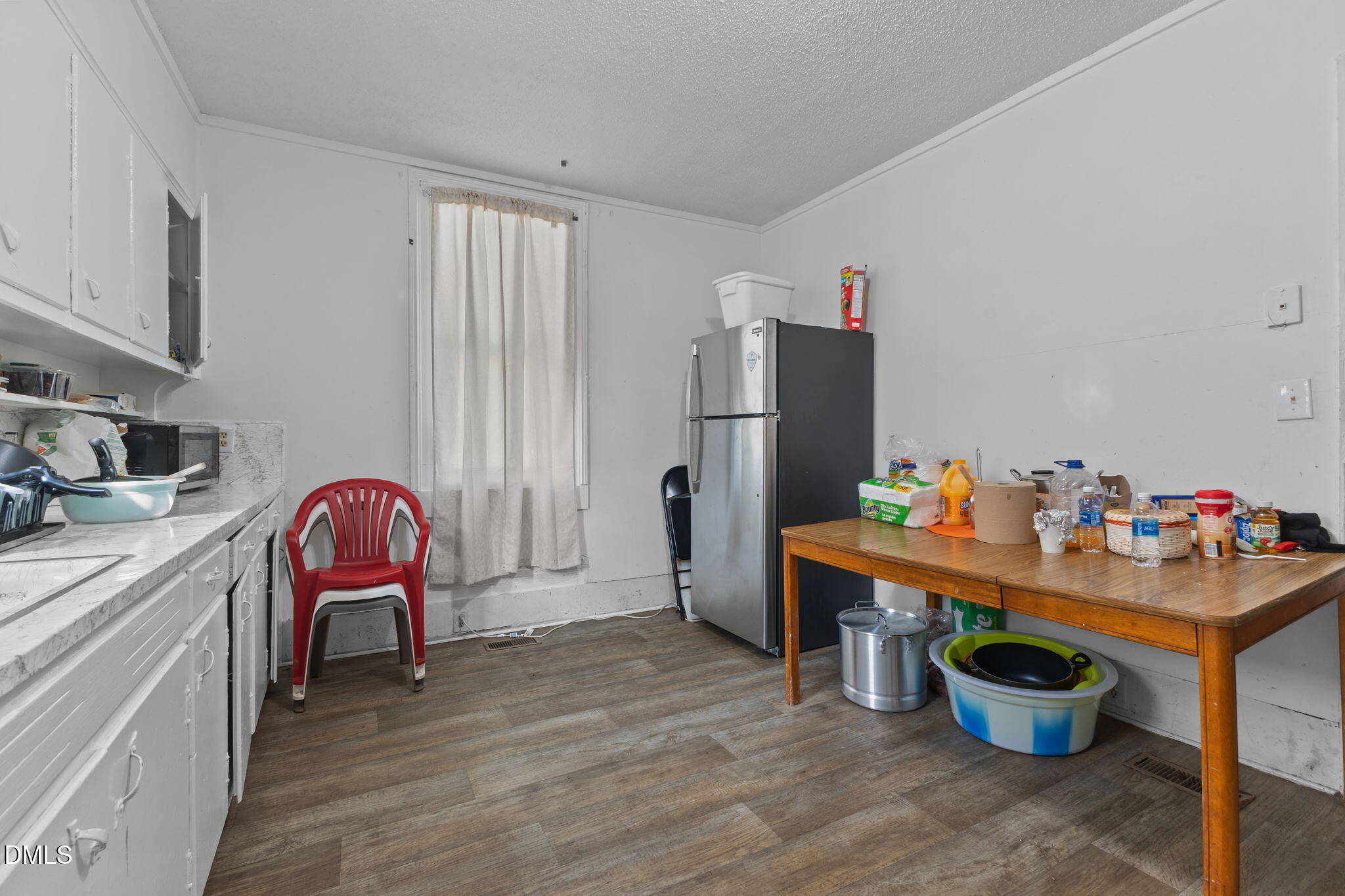 300 Devane Street Clinton, NC 28328 - Photo 26 of 39 a room with a table and a chair