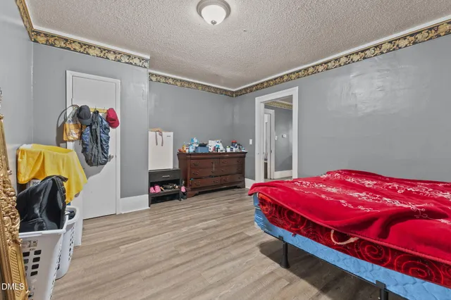 a bedroom with a bed and a walk in closet