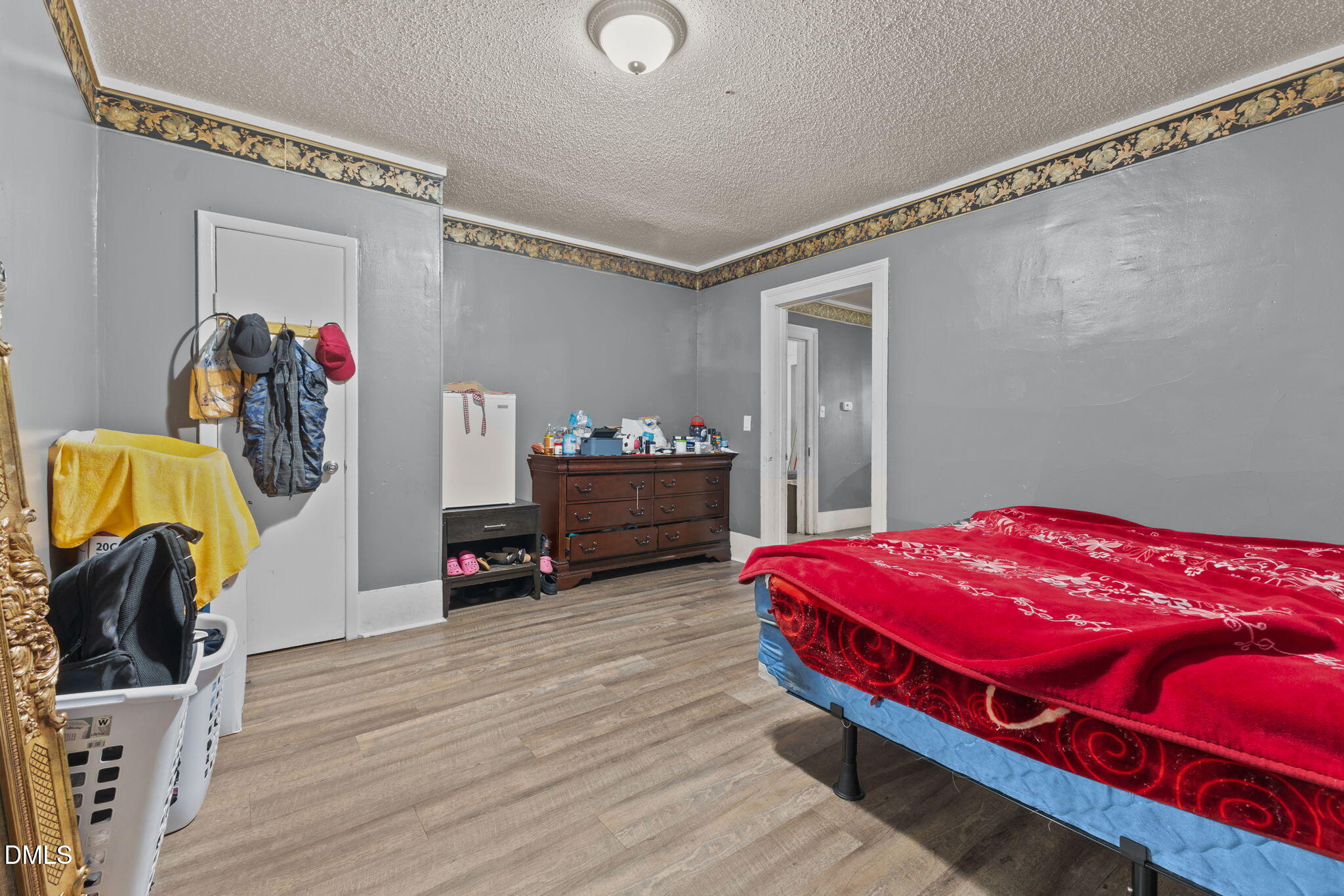 300 Devane Street Clinton, NC 28328 - Photo 32 of 39 a bedroom with a bed and a walk in closet