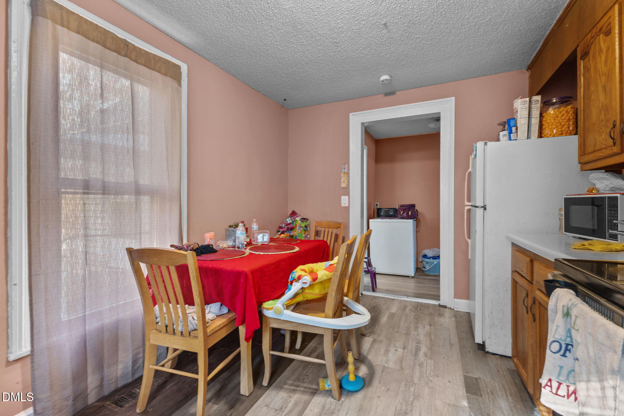 300 Devane Street Clinton, NC 28328 - Photo 6 of 39 a dining room with furniture and wooden floor