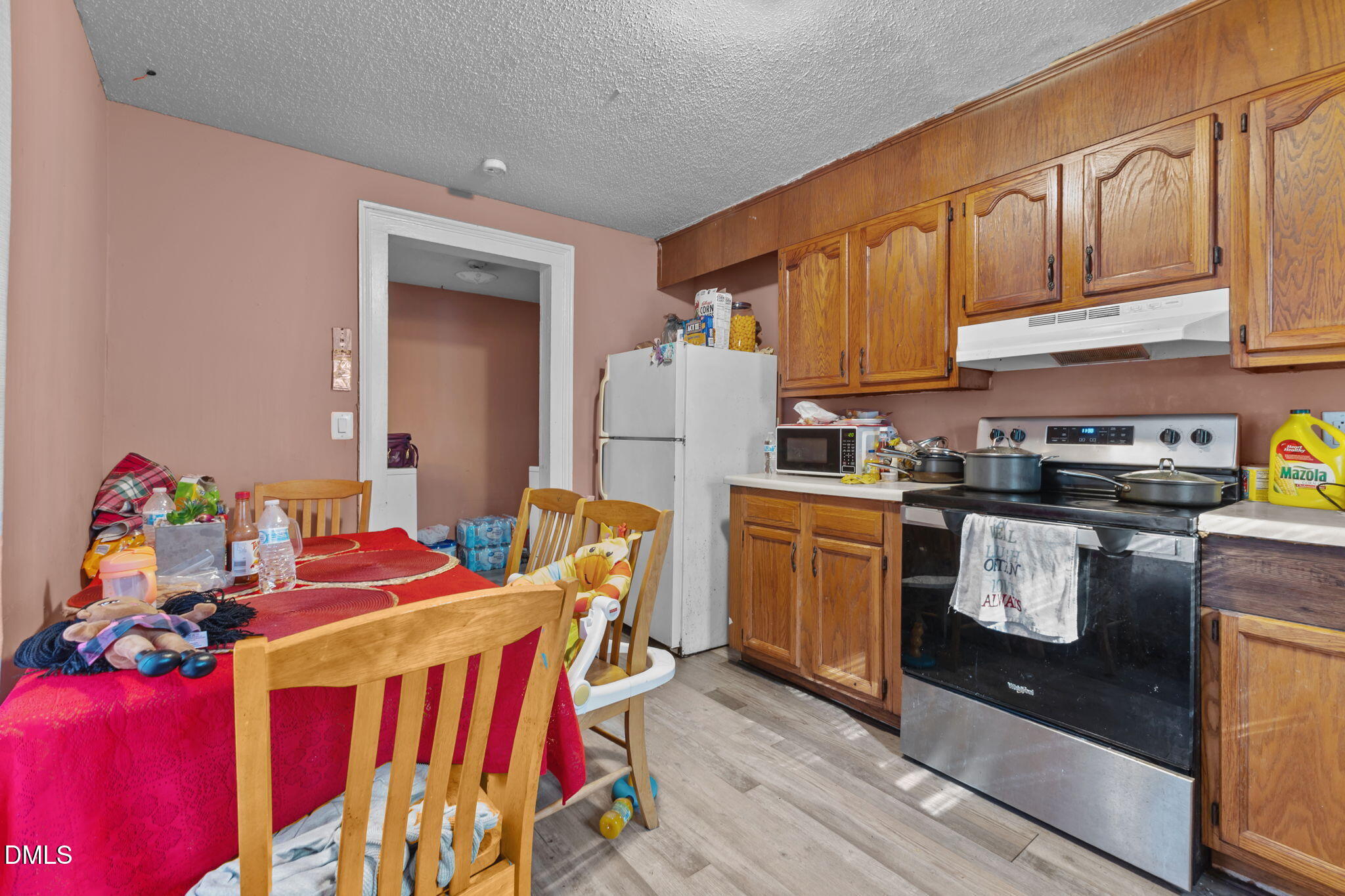 300 Devane Street Clinton, NC 28328 - Photo 7 of 39 a kitchen with stainless steel appliances granite countertop a sink a stove and refrigerator