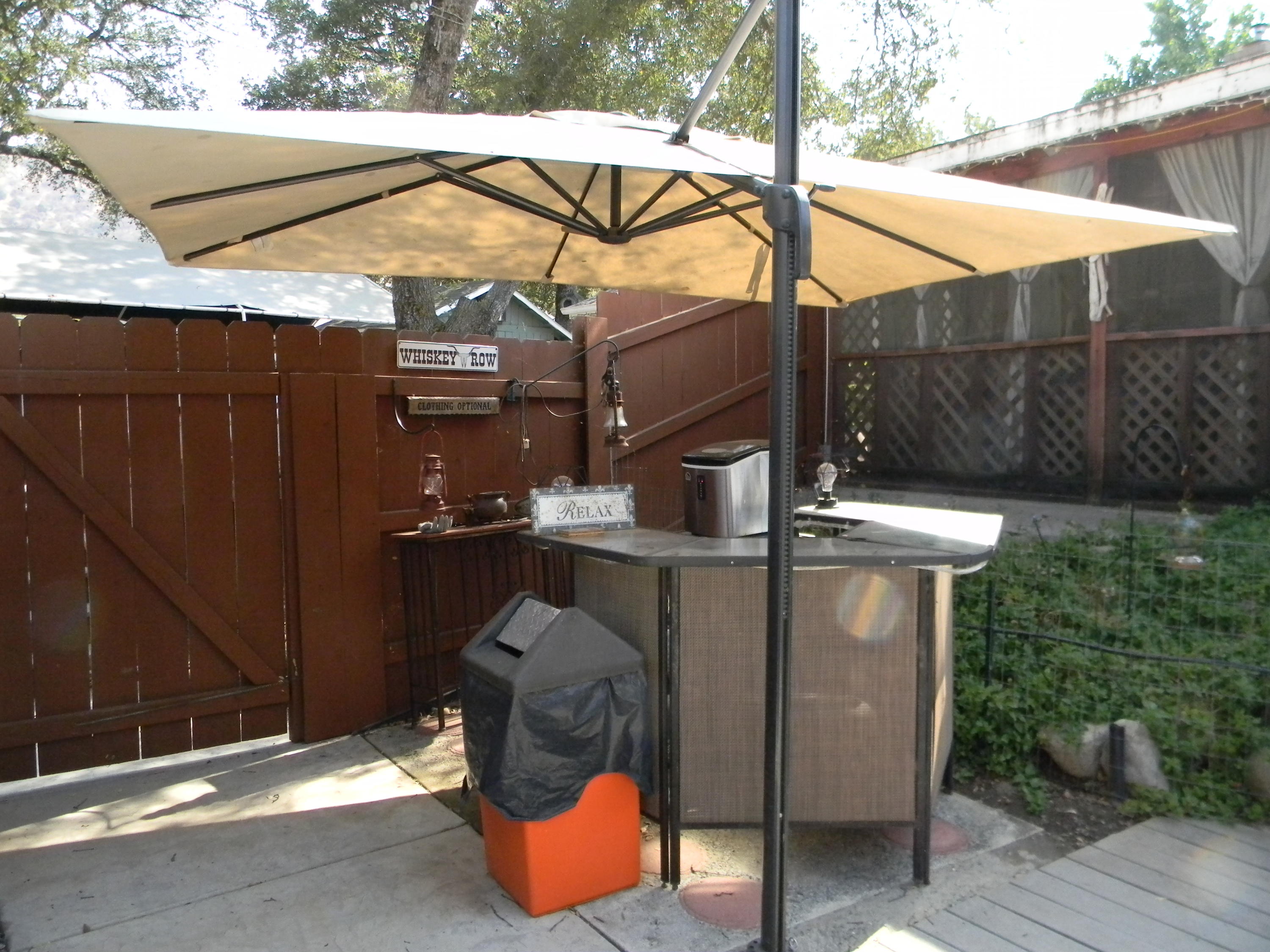 40992 Meadow Drive Three Rivers, CA 93271 - Photo 12 of 29 a view of a patio with table and chairs under an umbrella