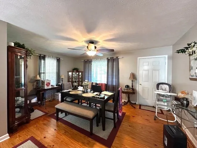 a living room with furniture a rug and a chandelier