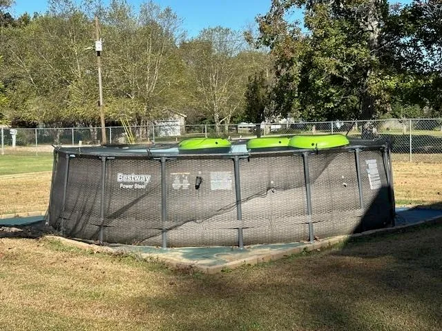 a view of a swimming pool with a patio