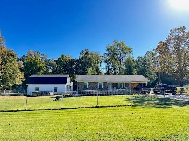 a view of a house with swimming pool