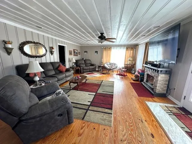 a living room with furniture and a flat screen tv