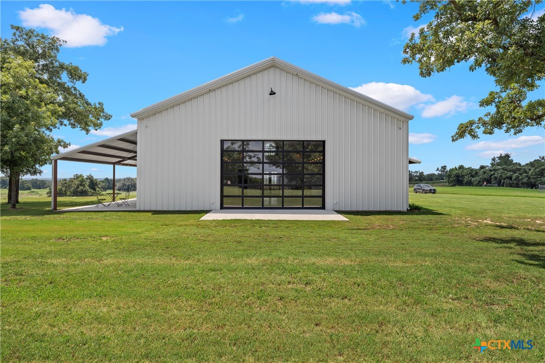 1006 County Road 280 Cameron, TX 76520 - Photo 15 of 48 a view of a house with a backyard