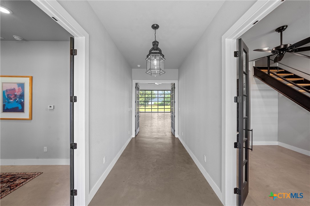 1006 County Road 280 Cameron, TX 76520 - Photo 29 of 48 a view of a hallway view with a wooden floor
