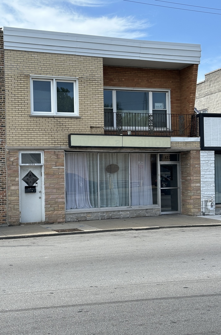 4237 West 63rd Street, Unit 2 Chicago, IL 60629 - Photo 1 of 1 a front view of a house with a garage