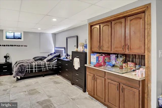 a bedroom with a bed and cabinets