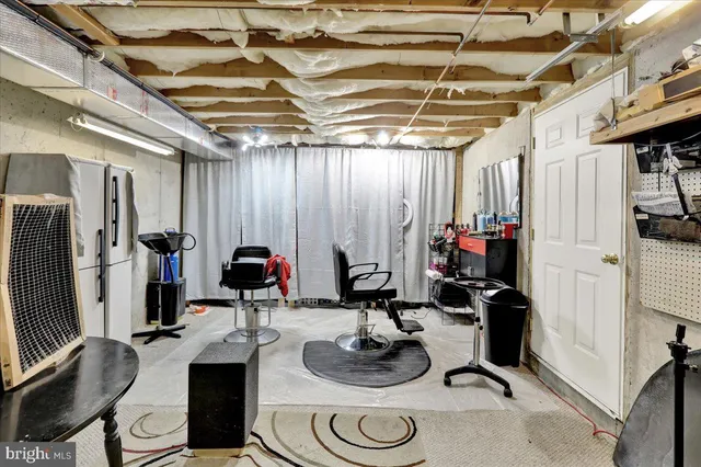 a room with gym equipment and a mirror