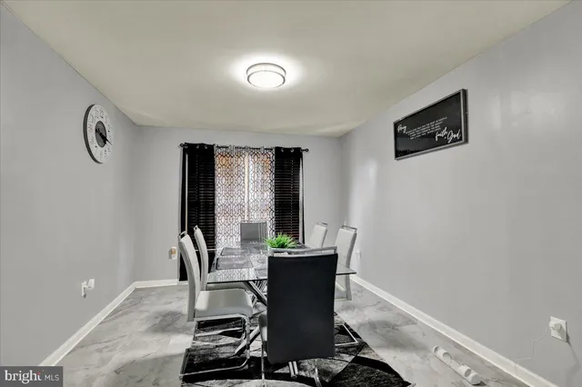 a view of a room with workspace and a window