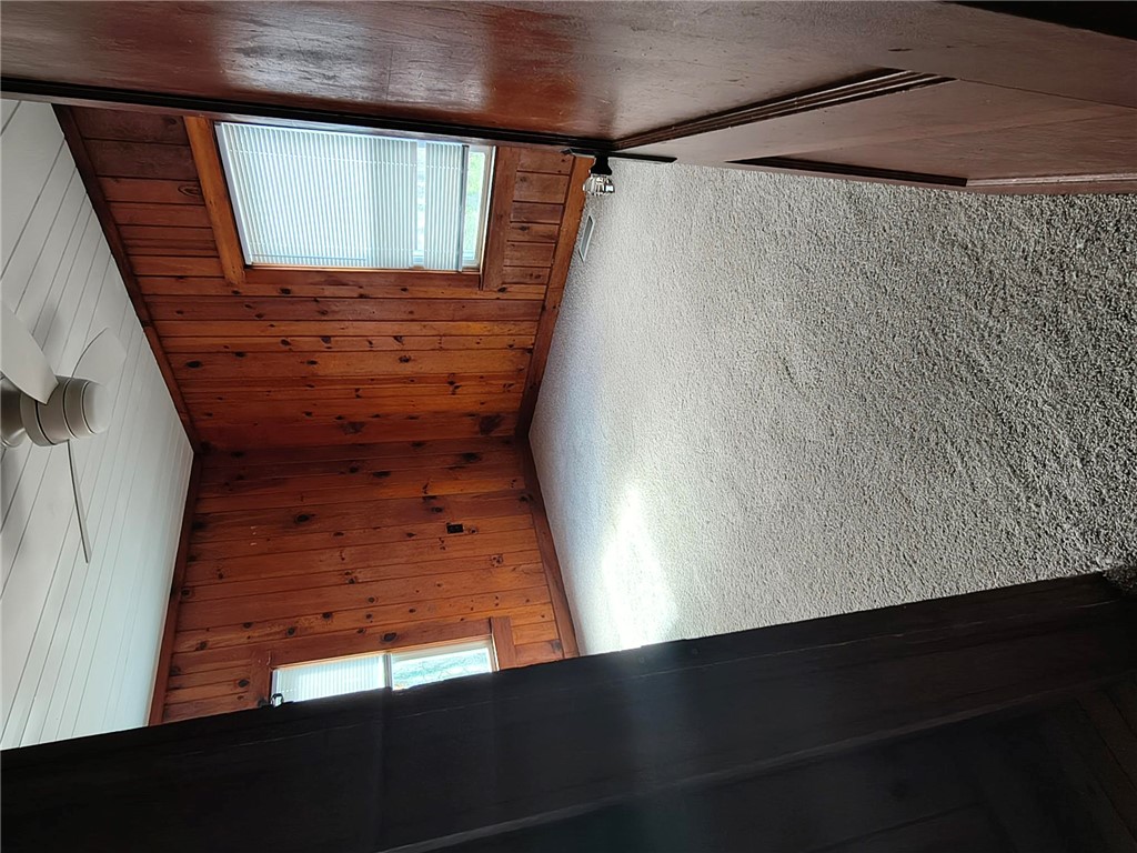 346 Clemson Street Clemson, SC 29631 - Photo 4 of 8 Natural wood paneling and vaulted ceilings create a warm, inviting atmosphere in this cozy loft space.