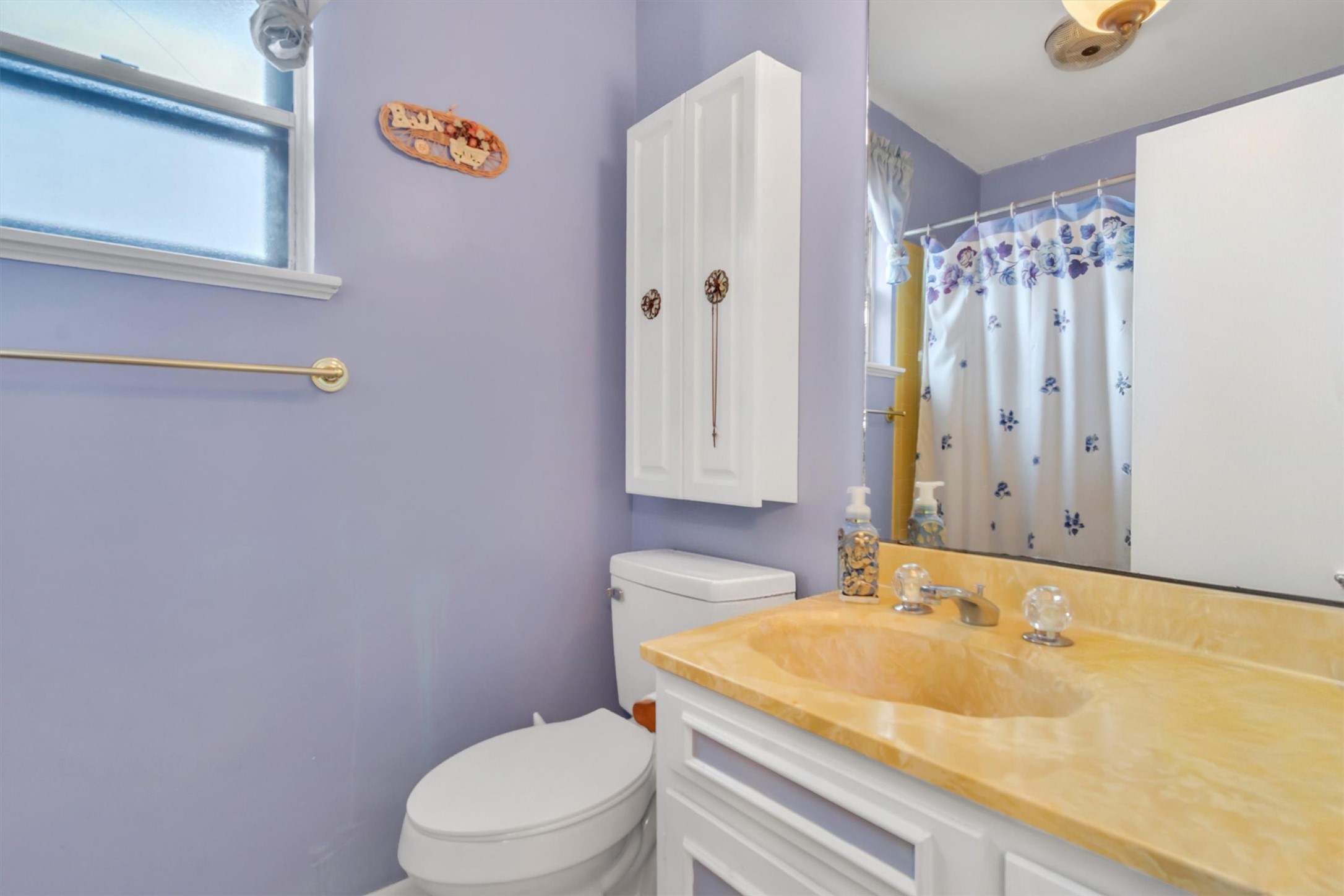 3100 Blue Ridge Drive Cedar Park, TX 78613 - Photo 15 of 34 a bathroom with a sink and toilet