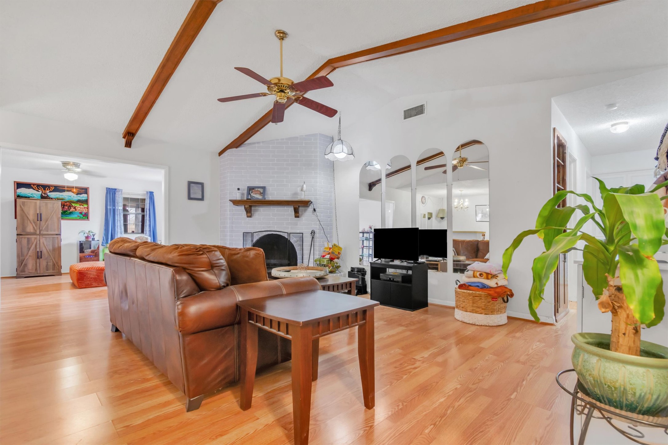 3100 Blue Ridge Drive Cedar Park, TX 78613 - Photo 16 of 34 a living room with furniture a fireplace and a flat screen tv