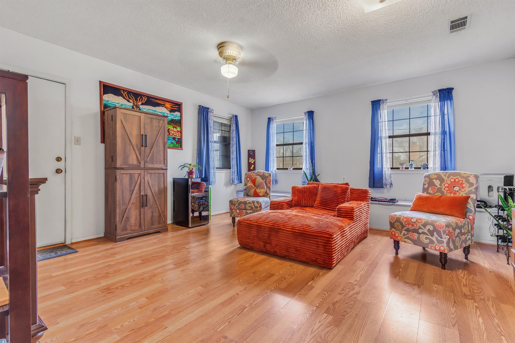 3100 Blue Ridge Drive Cedar Park, TX 78613 - Photo 20 of 34 a living room with furniture and a wooden floor