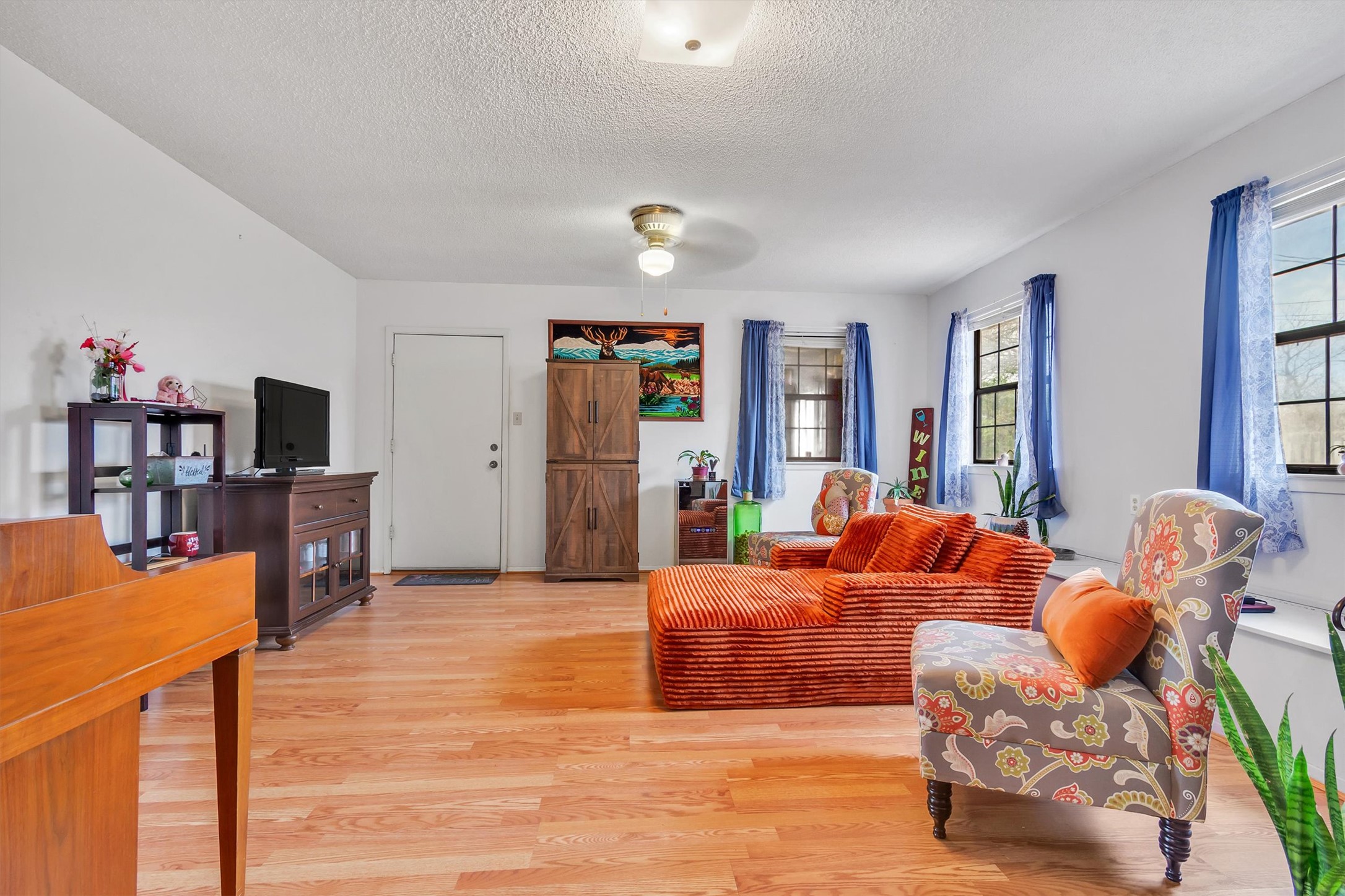 3100 Blue Ridge Drive Cedar Park, TX 78613 - Photo 21 of 34 a bedroom with furniture and a wooden floor