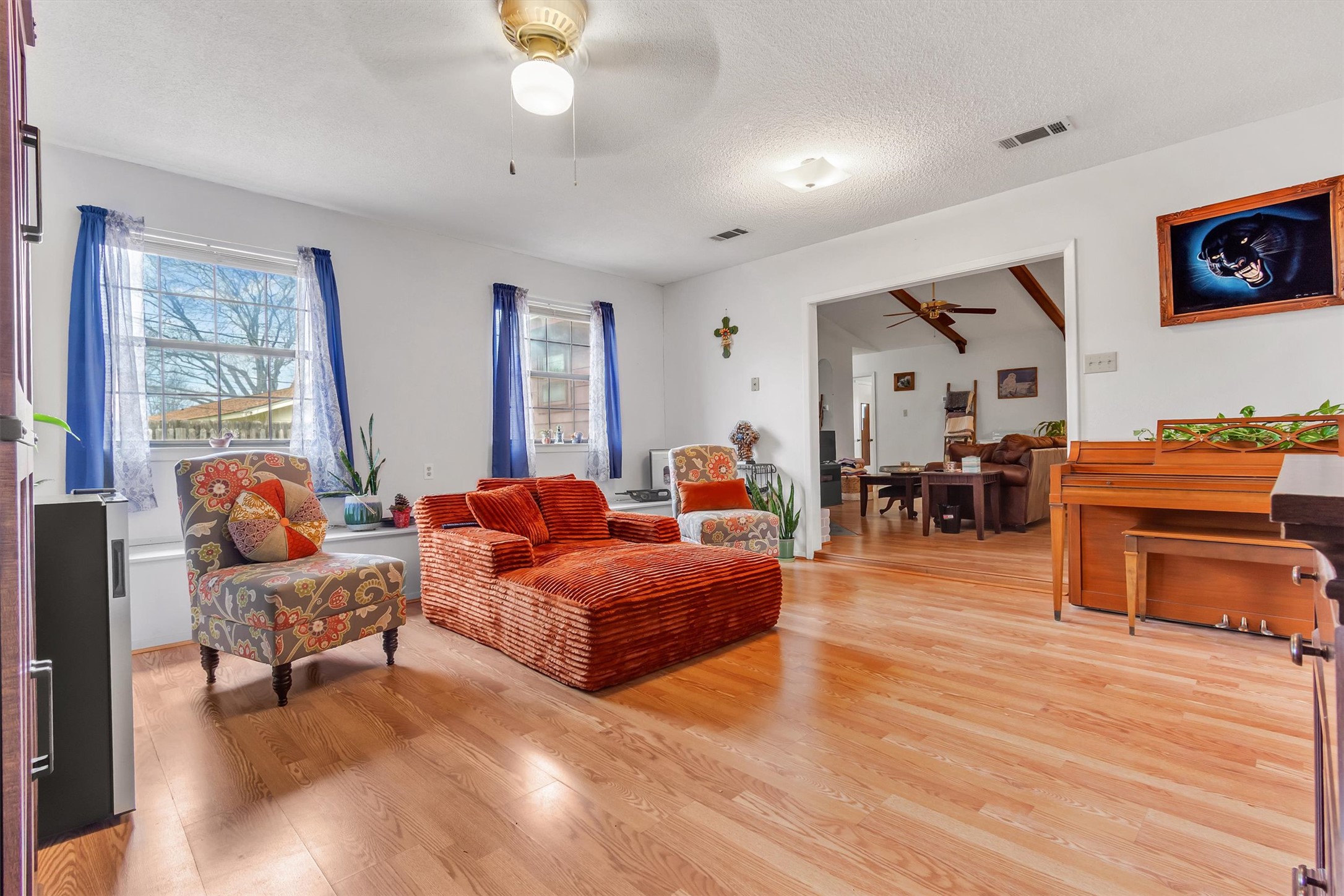 3100 Blue Ridge Drive Cedar Park, TX 78613 - Photo 22 of 34 a living room with furniture and a dining table with wooden floor