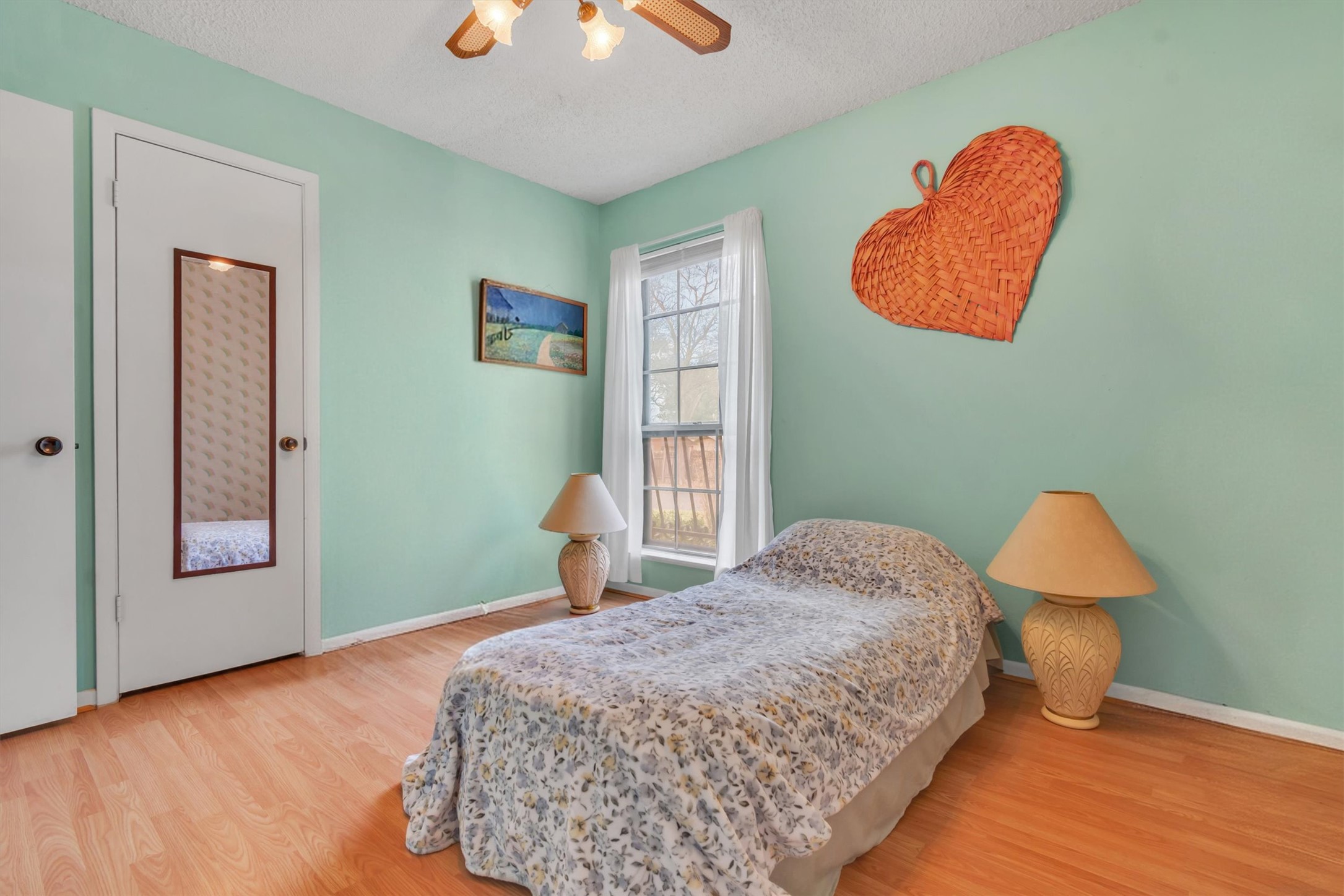 3100 Blue Ridge Drive Cedar Park, TX 78613 - Photo 5 of 34 a bedroom with a bed and a lamp