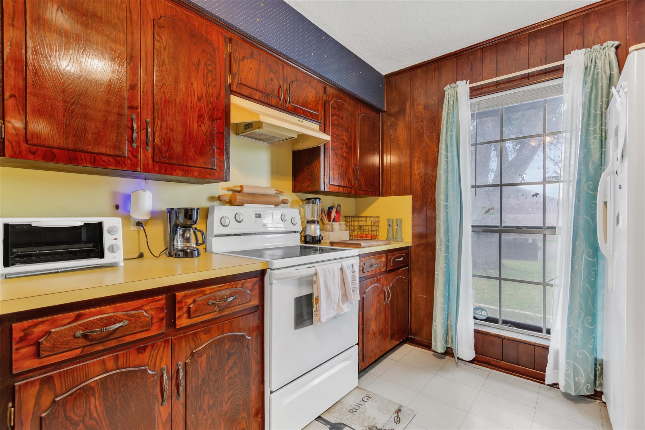3100 Blue Ridge Drive Cedar Park, TX 78613 - Photo 10 of 34 a kitchen with stainless steel appliances granite countertop a sink stove and cabinets