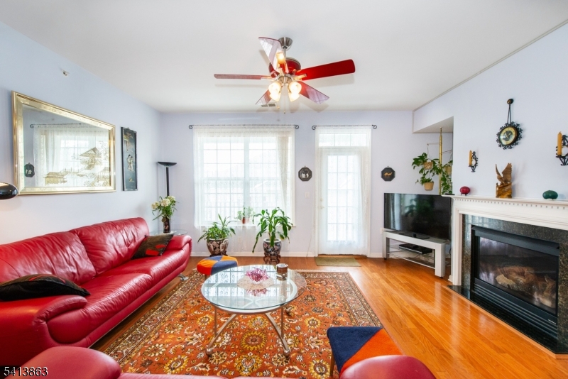 9 Cliff Road, Unit D3 Woodland Park, NJ 07424 - Photo 22 of 25 a living room with furniture and a fireplace