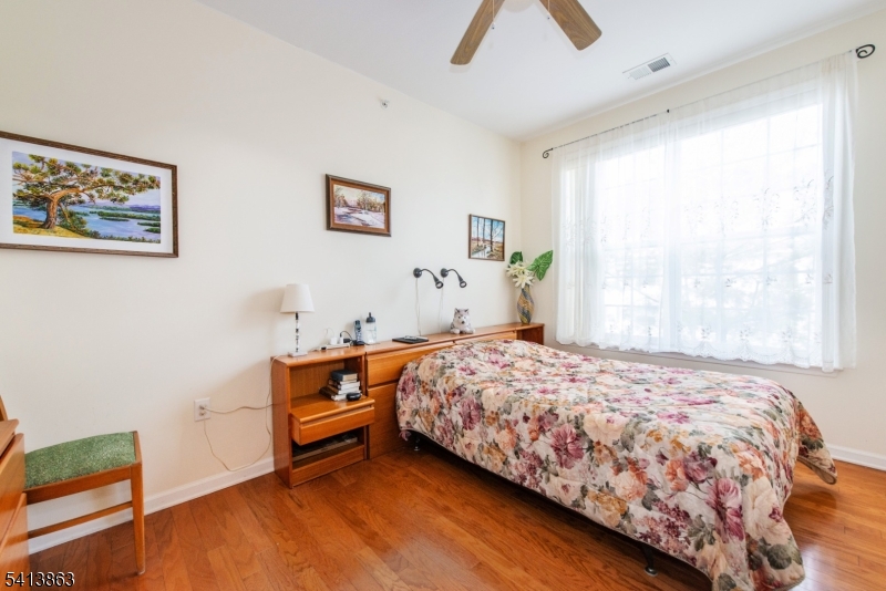 9 Cliff Road, Unit D3 Woodland Park, NJ 07424 - Photo 7 of 25 a bedroom with a bed and a window