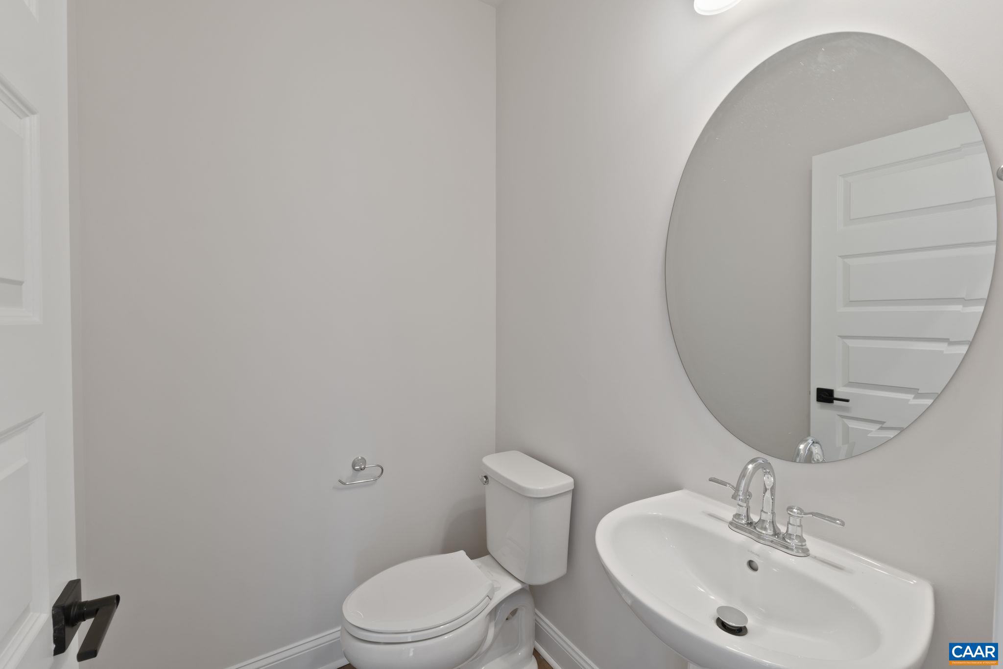 47 Marcella Street Charlottesville, VA 22911 - Photo 14 of 48 a bathroom with a sink a toilet and mirror
