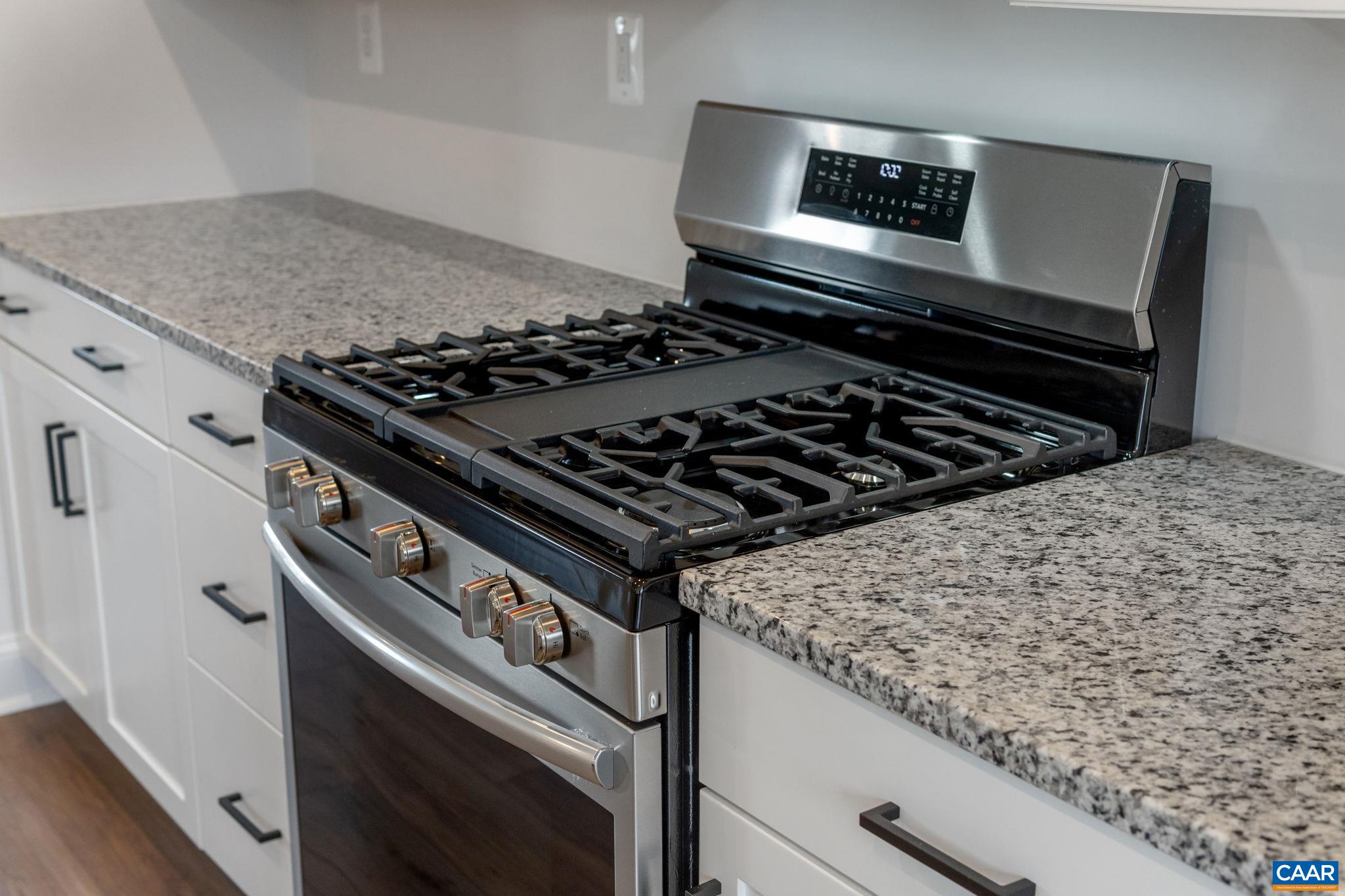 47 Marcella Street Charlottesville, VA 22911 - Photo 19 of 48 a stove top oven sitting inside of a kitchen
