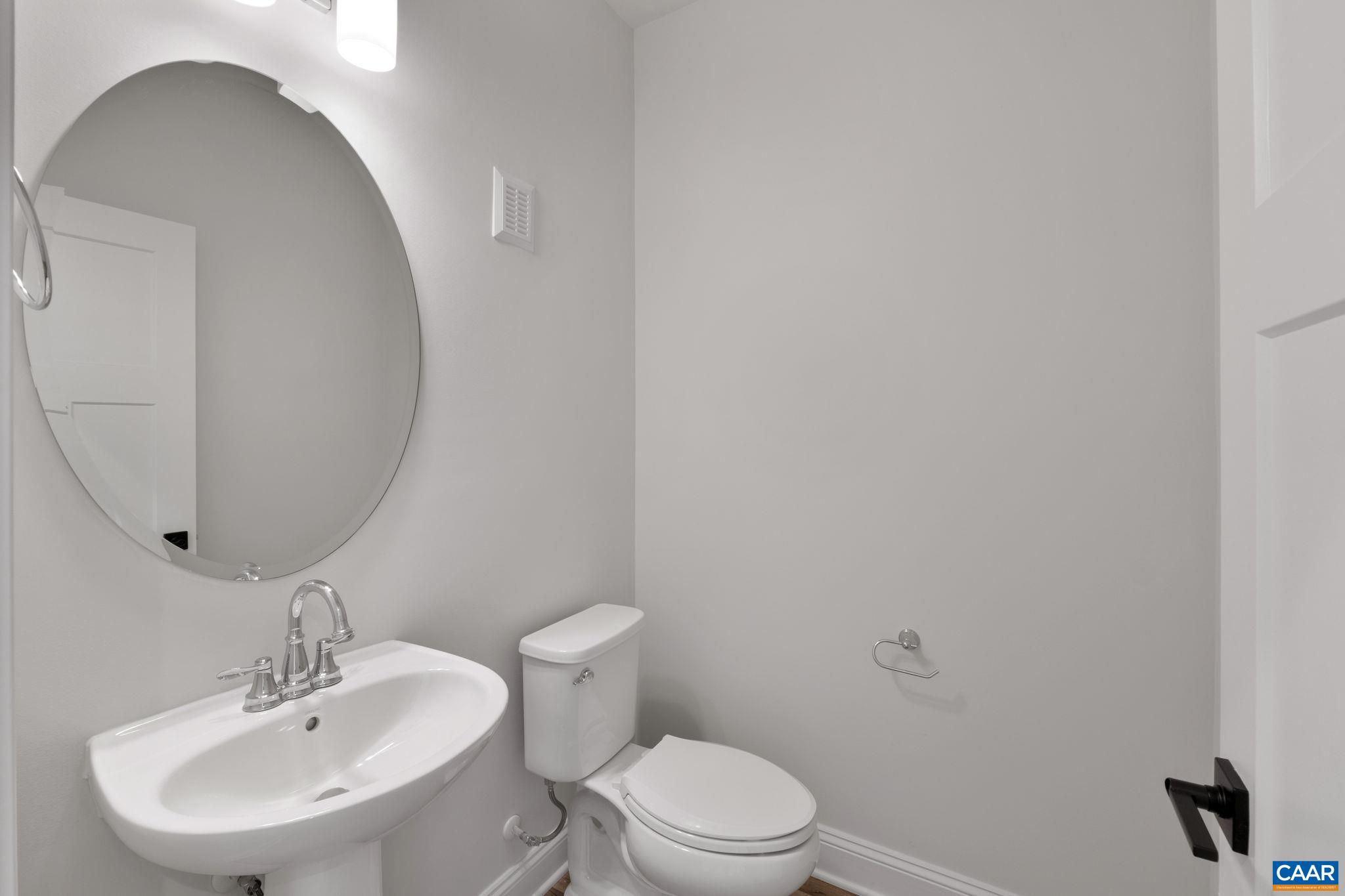 47 Marcella Street Charlottesville, VA 22911 - Photo 6 of 48 a bathroom with a toilet a sink and mirror