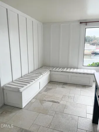 a view of a bathroom with bathtub and window