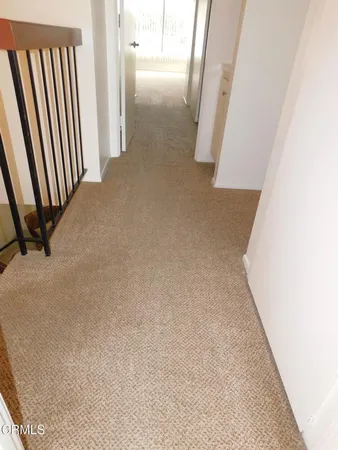 an entryway with a rug