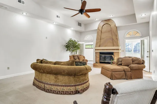 a kitchen with a sink window and cabinets
