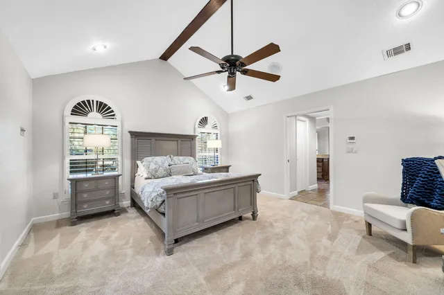 a living room with furniture kitchen view and a fireplace