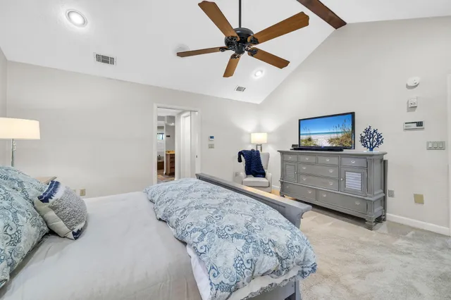 a spacious bathroom with a tub sink and mirror