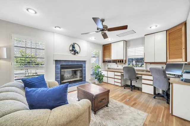 a bathroom with a granite countertop sink a mirror and a bathtub