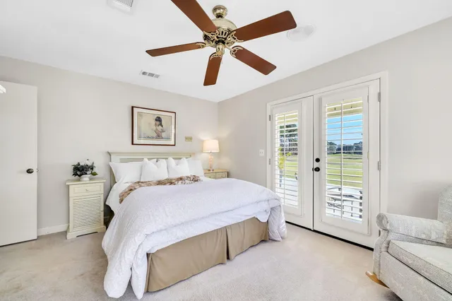 a bedroom with bed and window